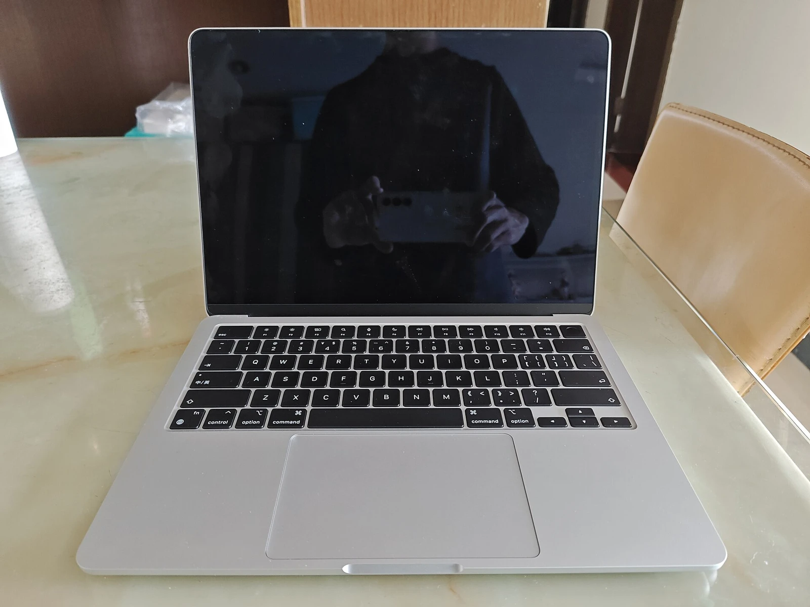 The keyboard, trackpad and display in view.